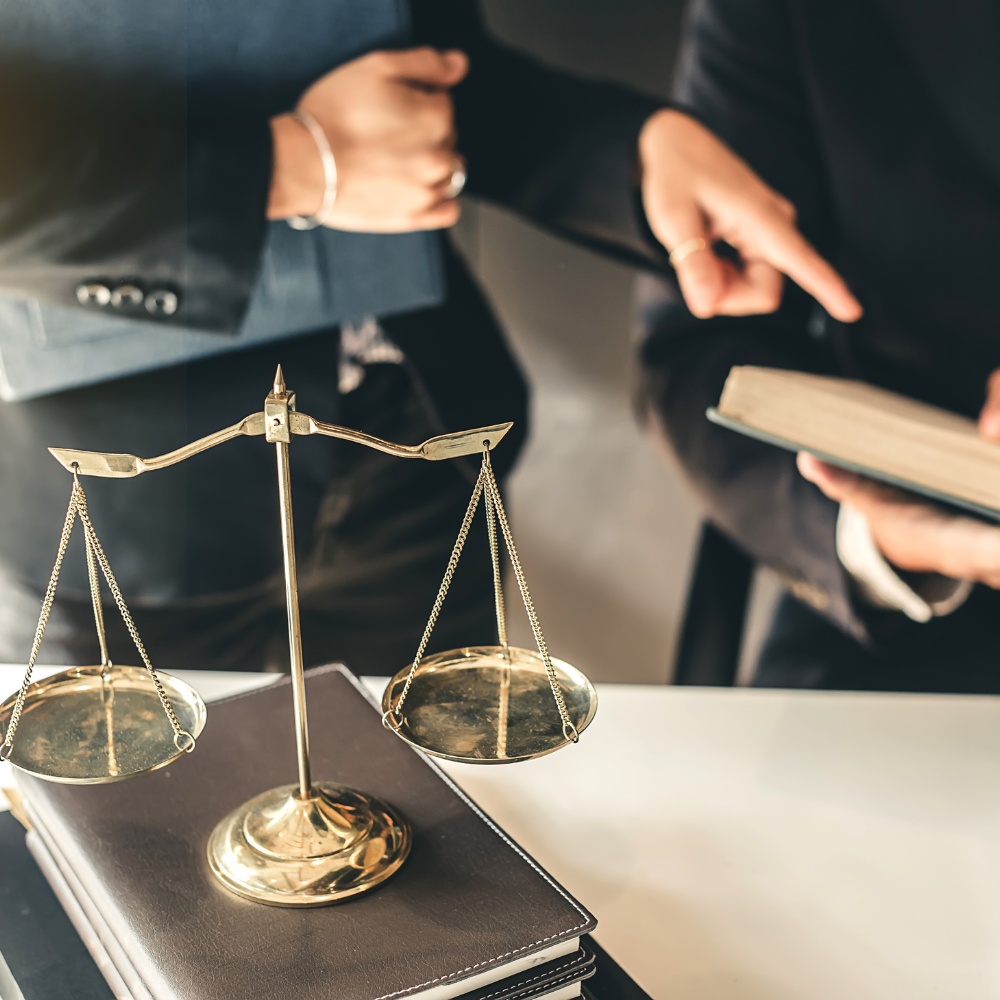 Attorneys reviewing legal documents in a law office.